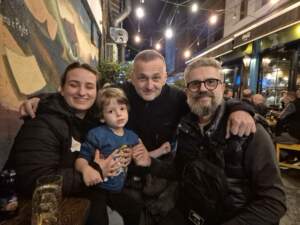 <em>Ardian, Dorontina and their son Doar with Virtyt Gacaferri at Café Dio in Peja</em>